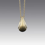 A BUNDA 18 carat yellow gold 'Bundova' pendant set with round brilliant cut diamonds, on an 18 carat yellow gold 'Trace' chain.  Characteristics of diamonds: 49 = 0.32ct, F colour, VS clarity.