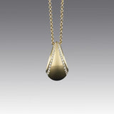 A BUNDA 18 carat yellow gold 'Bundova' pendant set with round brilliant cut diamonds, on an 18 carat yellow gold 'Trace' chain.  Characteristics of diamonds: 49 = 0.32ct, F colour, VS clarity.