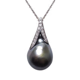 A BUNDA 'Caelum' Cultured Tahitian pearl and Diamond Pendant in 18 carat white gold, featuring a baroque shaped Tahitian pearl, set with a diamond threadset cap that follows the curve of the pearl and is fitted with an 18 carat white gold trace chain.  The pearl measures approximately 15.00 - 22.98mm, is green in colour, with a clean skin and an excellent lustre.  Characteristics of diamonds: 13 = 0.16ct, F colour, VS clarity.