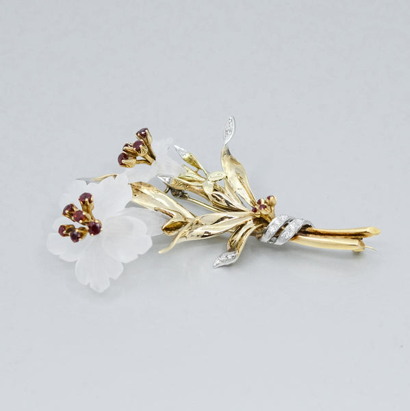 
                      
                        A Flower platinum and 14 yellow gold brooch
                      
                    