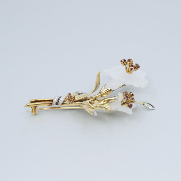 
                      
                        A Flower platinum and 14 yellow gold brooch
                      
                    