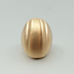 A BUNDA Boutique ring in bronze with a luxurious brushed satin finish. The ring's interior has a high polish. Looks great worn on the ring or middle finger.