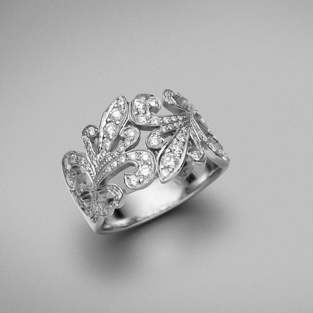 A BUNDA 'Tanara' Diamond Ring in Platinum. The ring has a 'fleur de lys' motif and is thread-set with round brilliant diamonds.   Characteristics of Round Brilliant Cut Diamonds: 79 = .81ct, F Colour, VS Clarity  Total weight: 12.21 grams