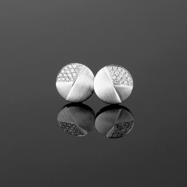 A pair of BUNDA 'Apus' diamond earrings in 18 carat white gold, set with round brilliant cut diamonds.