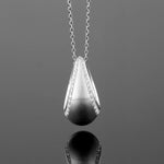 A BUNDA 18 carat white gold 'Bundova' pendant set with round brilliant cut diamonds, on an 18 carat white gold 'Trace' chain. Elegant everyday wear.  Characteristics of diamonds: 68 = 0.32ct, F/VS